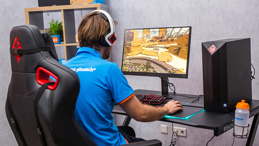 Man playing on 4K gaming monitor