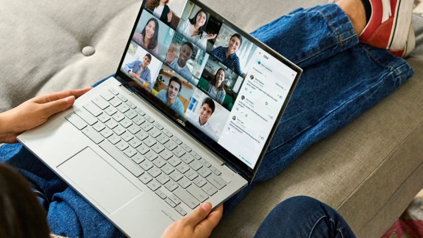 Man sitting on couch with Chromebook on lap